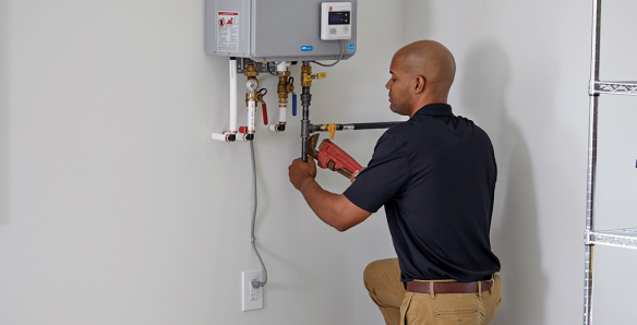 Man Installing a Tankless Water Heater.